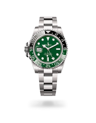 Rolex GMT-Master II in white gold with a green ceramic dial, bidirectional rotatable 24-hour graduated  bezel, and Oyster bracelet - Crisson
